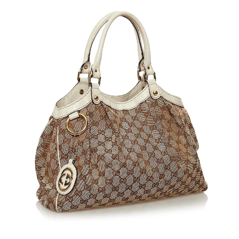 Women Gucci bags with a chain - link trim and a leather bodyGucci GG Canvas Sukey Tote Bag (34120)