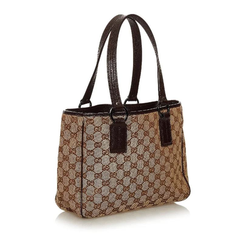 Women Gucci bags with a front - zip pocket for small itemsGucci GG Canvas Tote Bag (28886)