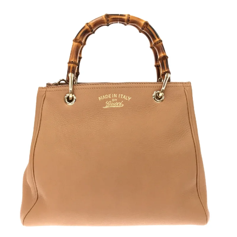 Women Gucci Sylvie bags with a leather - wrapped handleGucci Bamboo shopper Tote