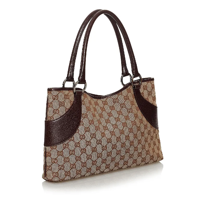 Women Gucci bags with a chain - link trim and a leather bodyGucci GG Canvas Tote Bag (30617)