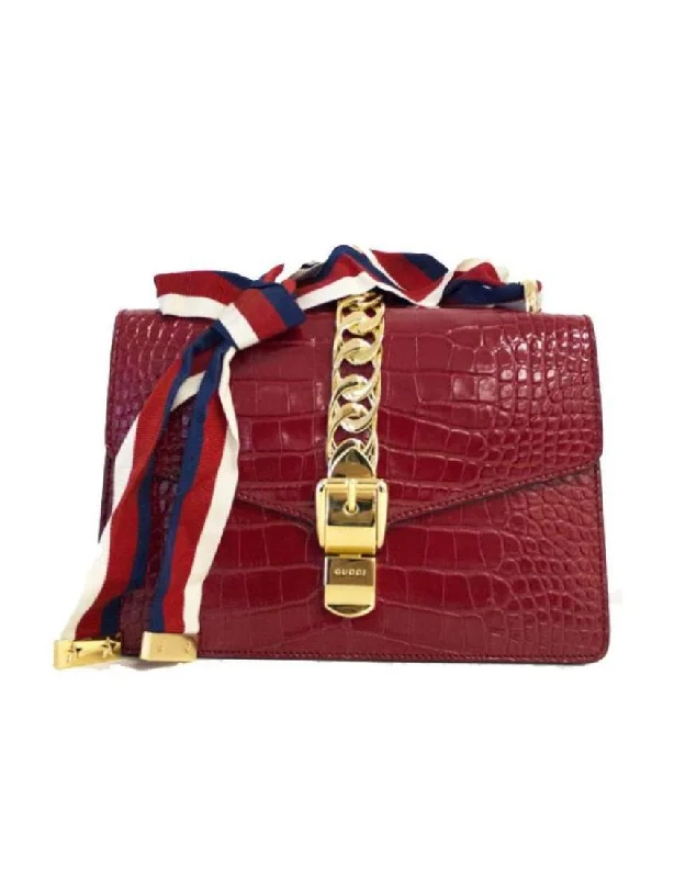 Women Gucci Sylvie bags with a leather - wrapped handleGucci Sylvie small shoulder bag