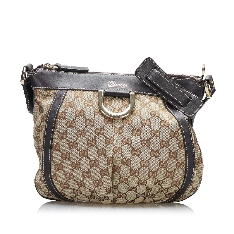 Women Gucci Sylvie bags with a monogram - embossed leatherGucci Abbey GG Canvas Crossbody Crossbody Bag