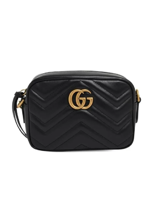 Women Gucci bags with a snap - button closure and a decorative charmGucci GG Marmont Collection Quilted Mini Handbag