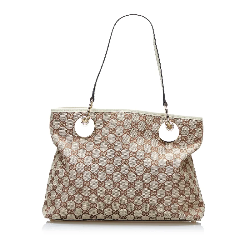 Women Gucci bags with a zippered interior pocketGucci GG Canvas Eclipse Tote Tote Bag