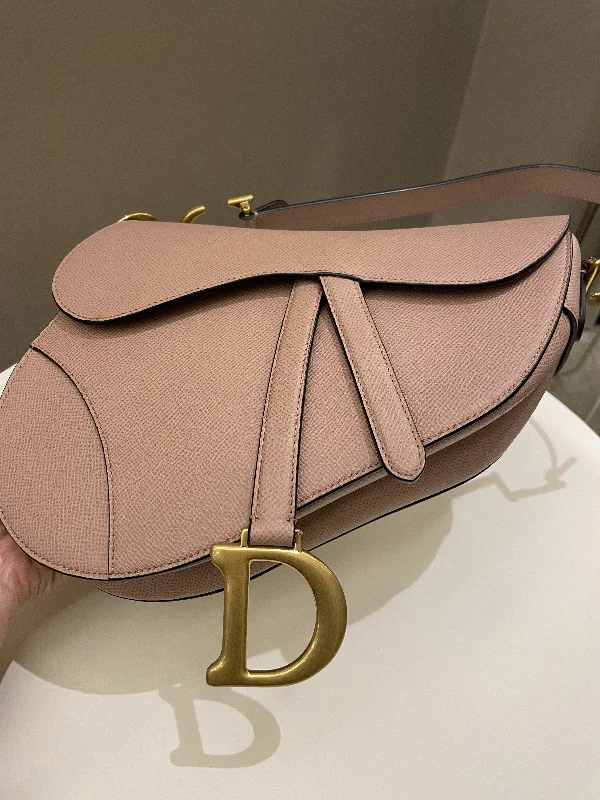 Christian Dior Saddle bags with a patent leather finish for a shiny lookDior Saddle Bag Nude Blush Grainy Leather