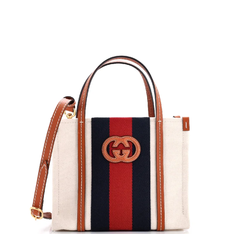 Women Gucci Sylvie bags with a monogram - embossed leatherInterlocking G Web Tote Canvas Mini