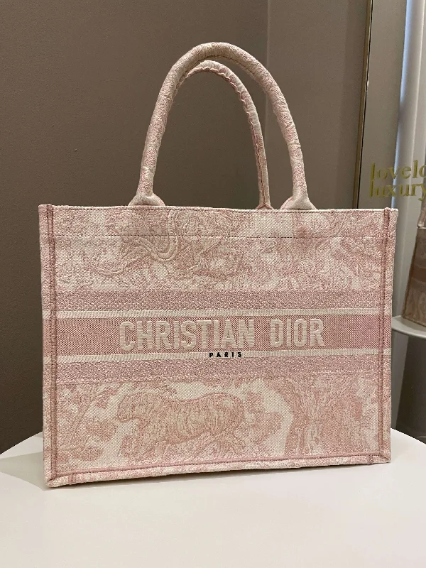 Christian Dior Saddle bags with a studded trim for a bold lookDior Toile De Jouy Book Tote Pink Embroidery